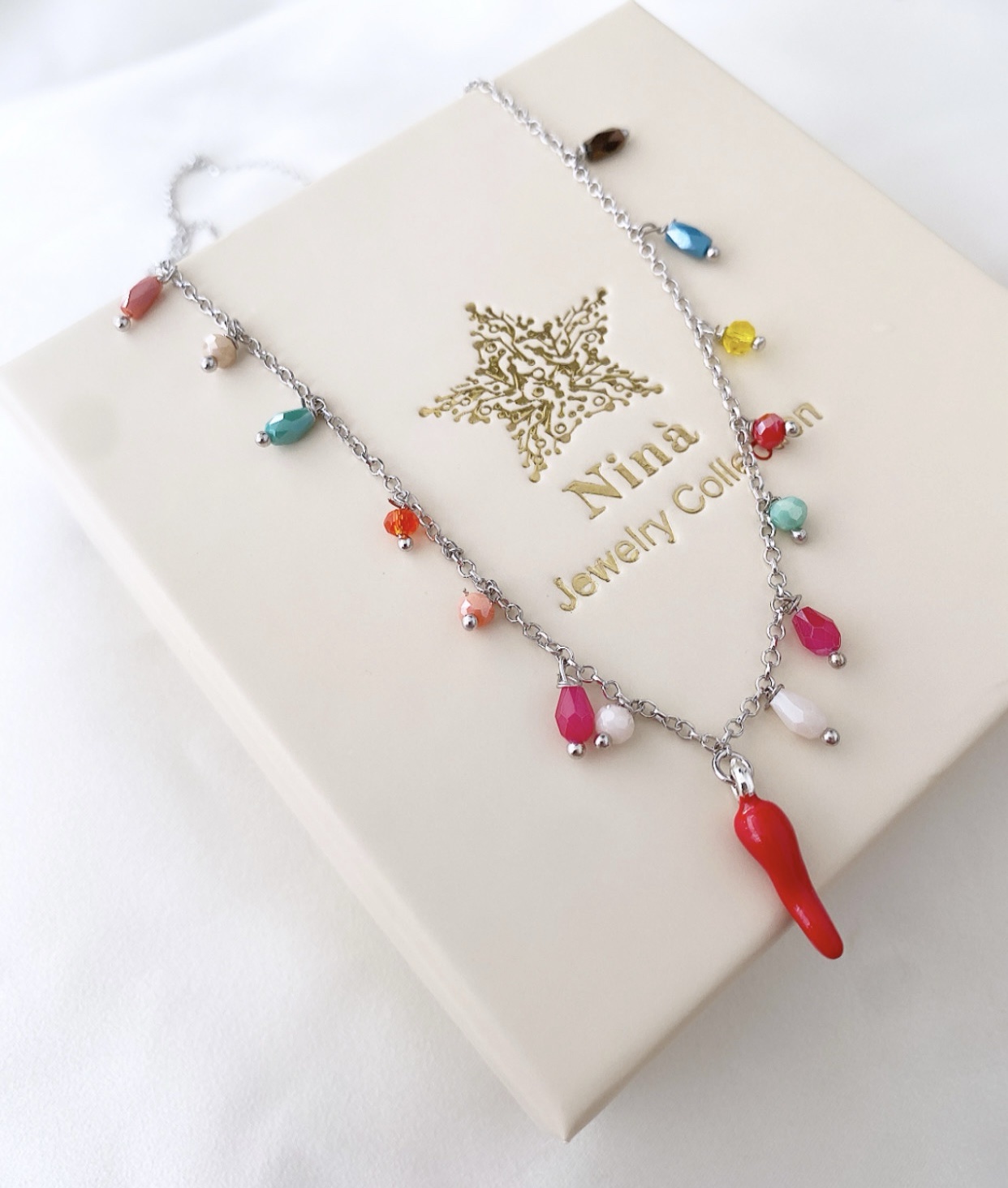 Collana cristalli colorati con corno