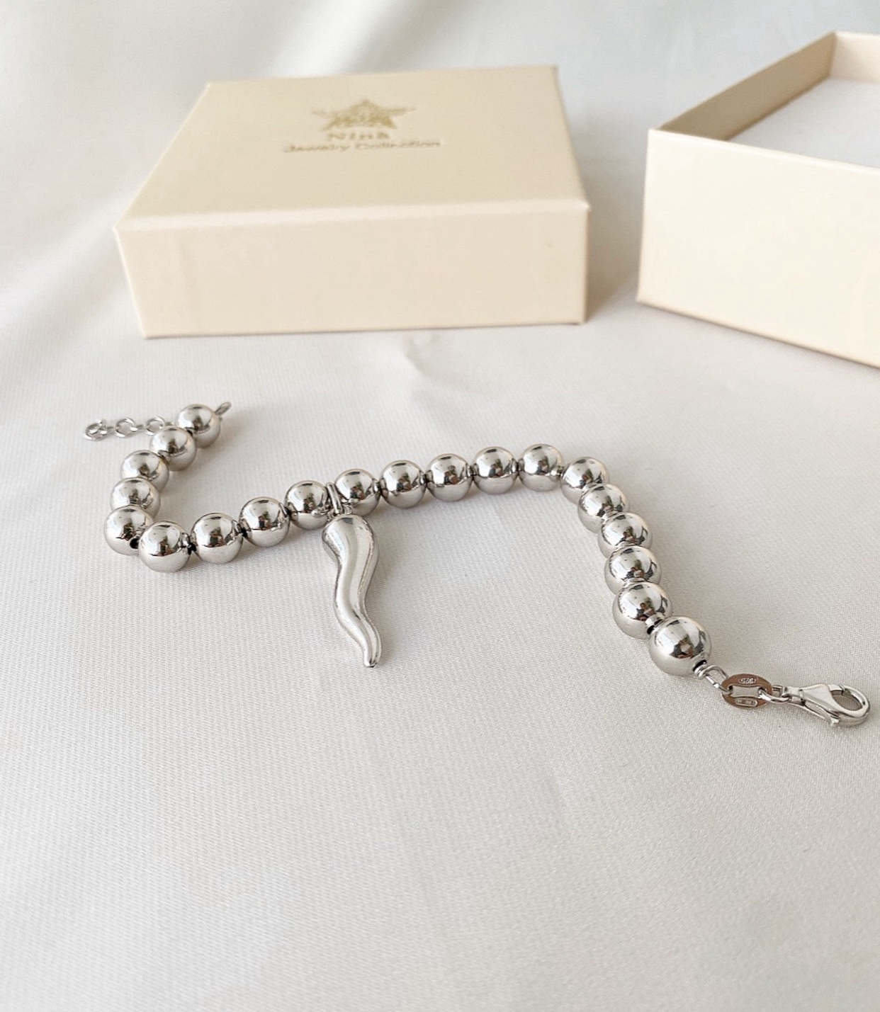Bracciale sfere e corno XL